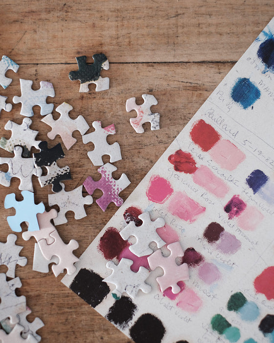 Puzzle artistique représentant une peinture d'un bouquet de fleurs, avec des nuances délicates.