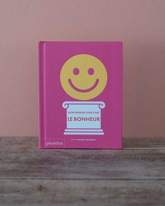 Livre pour enfants avec couverture illustrée, thème de l’art de vivre, vue frontale.